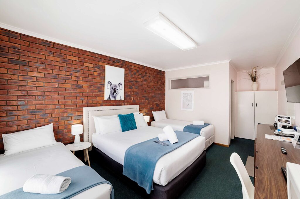 Queen room at City Heart Motel Warrnambool with clean bed, air conditioning, and modern furnishings