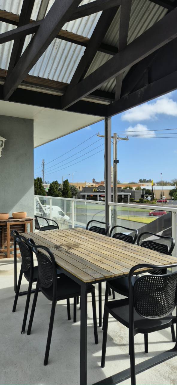 Covered outdoor seating at City Heart Motel